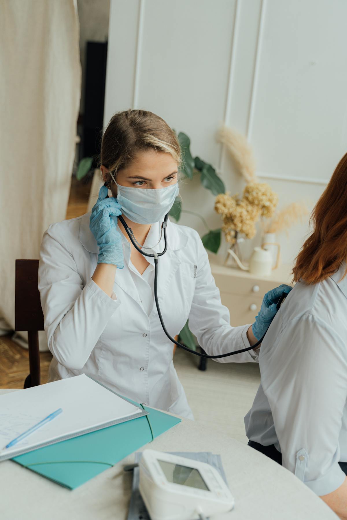 Doctor examining patient for fever and infection care